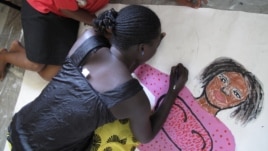 A woman living with HIV sketches her body map in Kisumu, Kenya, July 7, 2011. (X. Verhoest/VOA)