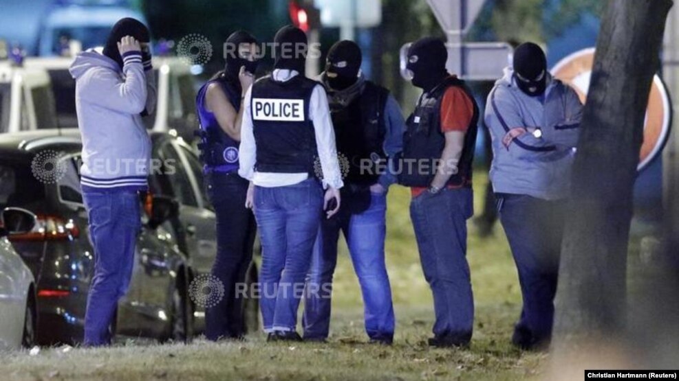 French policemen take part in a police raid at a residential building in Boussy-Saint-Antoine near Paris, France, Sept. 8, 2016. Police were investigating an abandoned car packed with gas cylinders near Paris' Notre Dame cathedral.