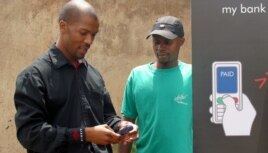 Cell phones are serving as a bank in your pocket, providing virtual accounts for South Africans excluded from the financial mainstream, Johannesburg's Soweto township, October 19, 2005.