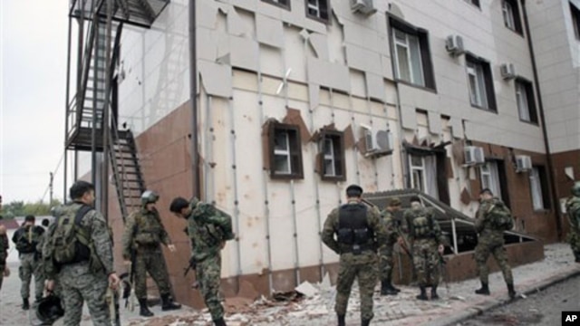 Special Force (OMON) officers  in front of Chechen parliament complex after a bomb blast in Grozny, Chechnya, 19 Oct 2010.