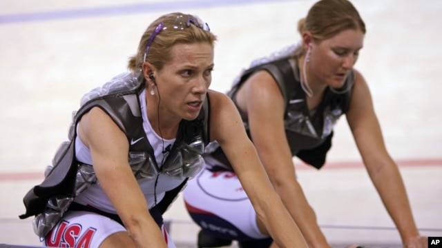 Dotsie Bausch (L) and teammate Lauren Michelle warm up at the World Track Cycling Championships in the Ballerup Arena, Copenhagen, Denmark, March, 24,  2010. 