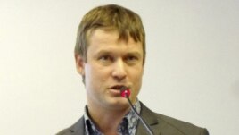 This undated photo shows Leonid Razvozzhayev speaking in an undisclosed location and is provided by the Associated Press Television News, October 22, 2012. 