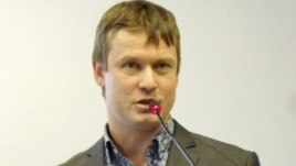 This undated photo shows Leonid Razvozzhayev speaking in an undisclosed location and is provided by the Assocoated Press Television News, October 22, 2012. 