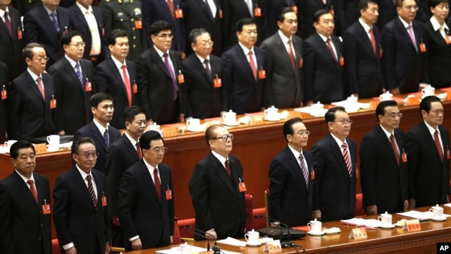 Leading party members including outgoing president Hu Jintao, (3rd left), stand singing of the Internationale, the international communist anthem, at the closing ceremony of the 18th Communist Party Congress held at the Great Hall of the People in Beijing