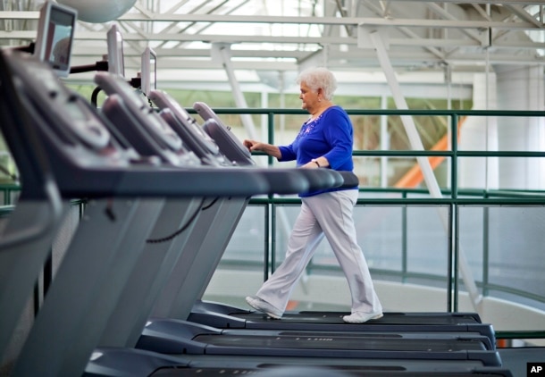 FILE - A woman who suffers from diabetes is seen walking on a treadmill as part of an exercise program to help control the disease.