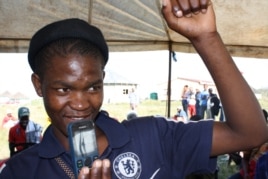 The winner with his prize… (D. Taylor/VOA)