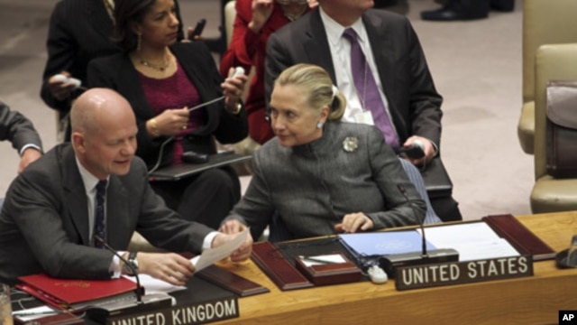 United States Secretary of State Hillary Rodham Clinton, right, speaks to United Kingdom Foreign Secretary William Hague before a UN Security Council meeting on the situation in Syria,  Tuesday, Jan. 31, 2012.