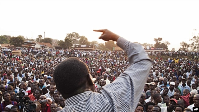 Ugandan opposition leader Kizza Besigye makes a speech during a protest rally against the rising cost of living and commodities in the Namungoona suburb of Kampala, January 24, 2012.