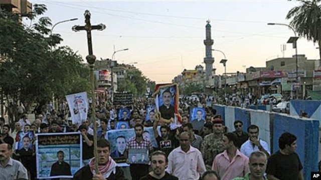 Muslims and Christians chant anti-terrorist slogans during a funeral of slain Christians in Baghdad, Iraq, 02 Nov 2010