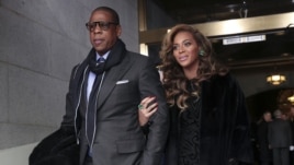Recording artists Jay-Z and Beyonce arrive on the West Front of the Capitol in Washington, Jan. 21, 2013, for the Presidential Barack Obama's ceremonial swearing-in ceremony during the 57th Presidential Inauguration.