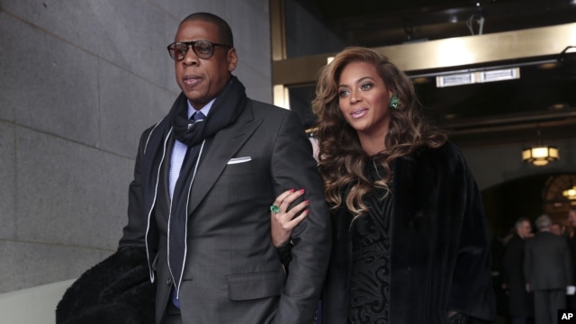 Recording artists Jay-Z and Beyonce arrive on the West Front of the Capitol in Washington, Jan. 21, 2013, for the Presidential Barack Obama's ceremonial swearing-in ceremony during the 57th Presidential Inauguration.