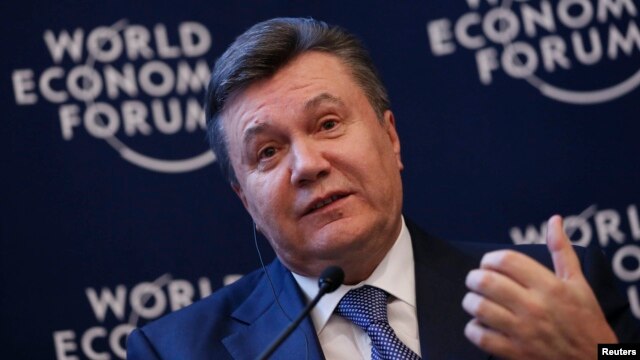Ukraine's President Viktor Yanukovich addresses delegates during the World Economic Forum in Davos, Switzerland, Jan. 24, 2013.
