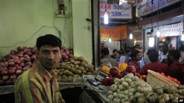 A vegetable seller, Vijay Kumar, waits for customers in his shop in an upscale INA market, in New Delhi, India (File Photo)