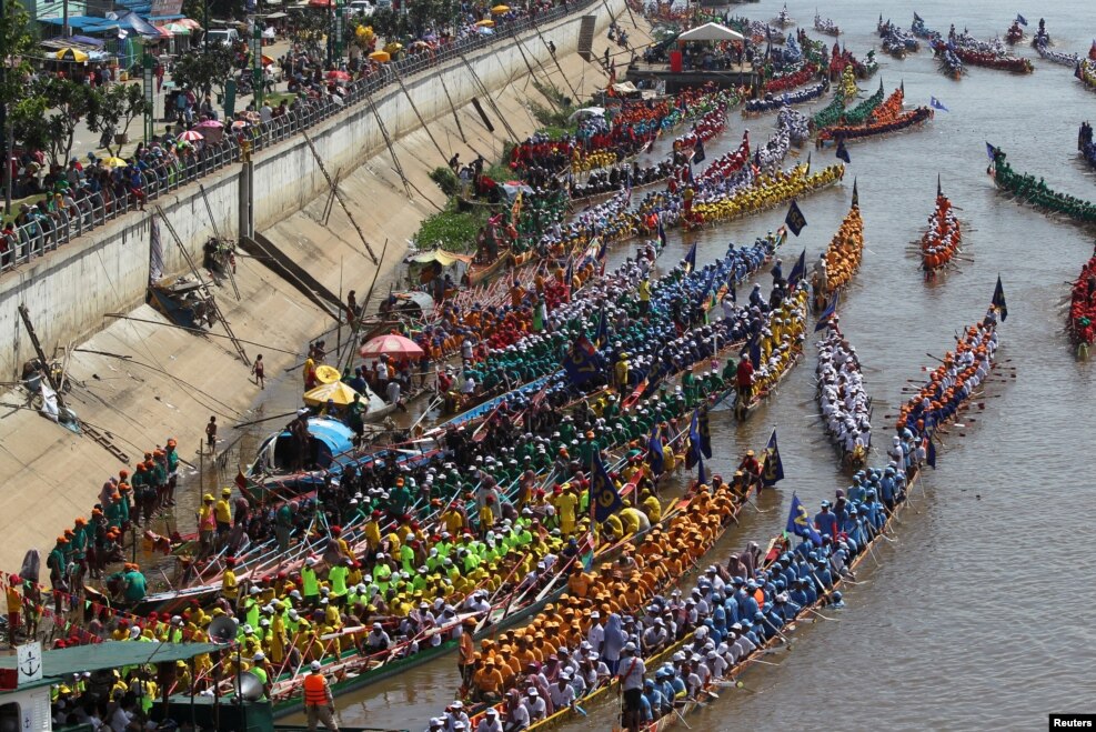 Rowers gather at the start of a boat race near the Royal Palace during the annual Water Festival on the Tonle Sap river in Phnom Penh, Cambodia.