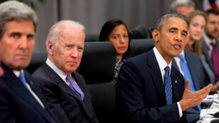 President Barack Obama, accompanied by, from left,  Secretary of State John Kerry, Vice President Joe Biden, and National Security Adviser Susan Rice, speaks during a meeting with Chinese President Xi Jinping at the Nuclear Security Summit in Washington, March 31, 2016.