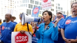 U.S. Congresswoman Judy Chu (D-Calif.) joins U.S. Post Office employees during a protest, April 24, 2014, in downtown Los Angeles.