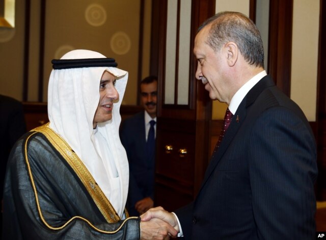 FILE - Turkey's President Recep Tayyip Erdogan, right, greets Saudi Arabia's Foreign Minister Adel al-Jubeir before a meeting in Ankara, Oct. 15, 2015.
