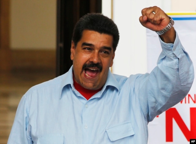 FILE - Venezuela's President Nicolas Maduro speaks during a demonstration, at Miraflores Presidential Palace in Caracas, April 7, 2016.