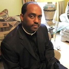 Father Reginald Jean-Marie travels to Haiti almost weekly to help earthquake survivors