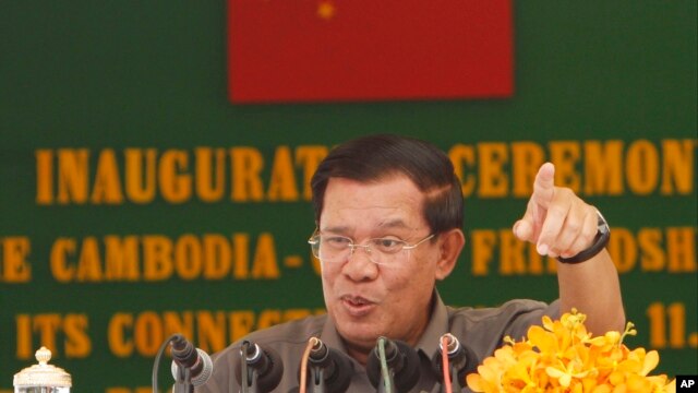 Cambodia's Prime Minister Hun Sen gestures as he delivers a speech during his presiding over an inauguration ceremony for the official use of a friendship bridge between Cambodia and China at Takhmau, Kandal provincial town south of Phnom Penh, file photo.