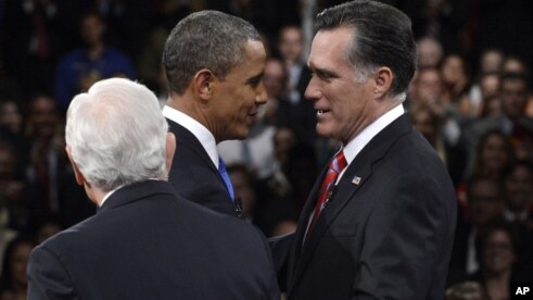 President Barack Obama and Republican presidential nominee Mitt Romney greet one another as moderator Bob Schieffer watches at the start of the third presidential debate at Lynn University, October 22, 2012.