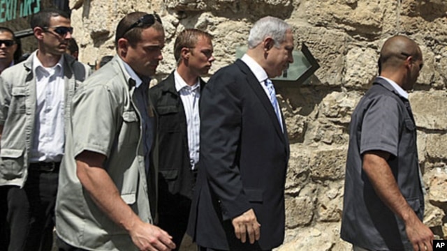 Israeli Prime Minister Benjamin Netanyahu, second from right, arrives at a special cabinet meeting marking upcoming Jerusalem Day at the Tower of David Museum, near Jaffa Gate in Jerusalem's Old City, May 29, 2011