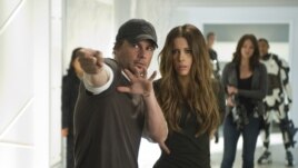 Director Len Wiseman (left foreground) and actor Kate Beckinsale (right foreground) on the set of Columbia Pictures' action thriller TOTAL RECALL.