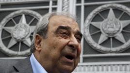 Prominent Syrian opposition activist Michel Kilo talks to the media after a meeting with Russia's Foreign Minister Sergei Lavrov in front of the Foreign Ministry headquarters in Moscow, July 9, 2012. 