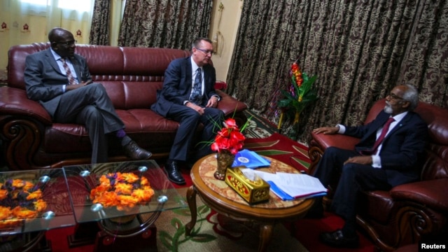 U.N. Under-Secretary General for Political Affairs Jeffrey Feltman (C) talks with the Speaker of the Somali Parliament Osman Jawari (R), at Villa Somalia in the capital Mogadishu, in this handout photo taken and provided by the African Union-United Nation