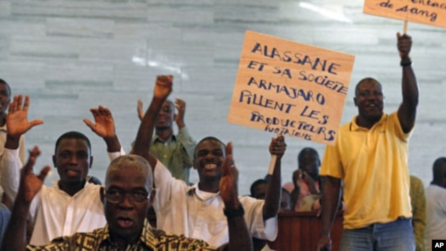 People protest against the European Union in Abidjan, and Ivory Coast cocoa exporters said they feared for their future after presidential claimant Alassane Ouattara said he would extend one-month cocoa export ban if his rival refuses to leave power, Febr