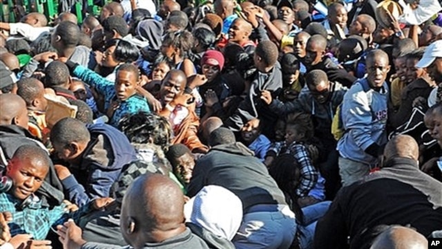Thousands of young students and their parents push their way into the gates causing a stampede at the University of Johannesburg, South Africa on Jan. 10, 2012. One person died and two others were seriously injured, officials said.