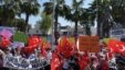 Residents wave national flags as they protest against plans to build a refugee camp under the new EU-Turkey deal in Aegean resort of Dikili, Izmir, Turkey, April 2, 2016.  