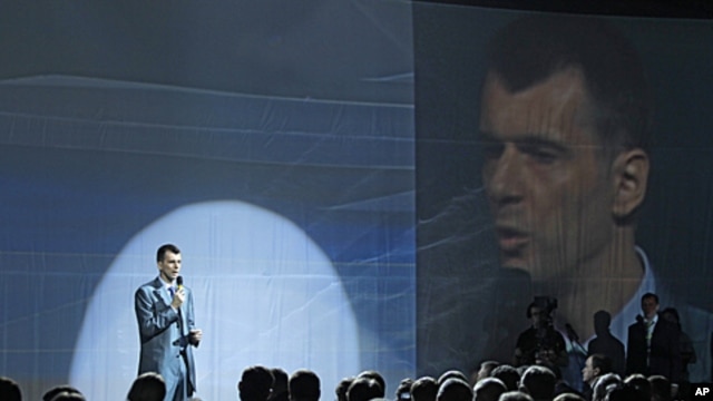 Russian tycoon Mikhail Prokhorov speaks at a meeting of the Right Cause party in Moscow, June 25, 2011.