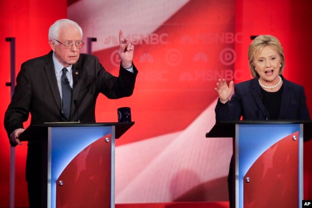 Sen. Bernie Sanders of Vermont reacts to former Secretary of State Hillary Clinton's answer to a question during a Democratic presidential primary debate hosted by MSNBC at the University of New Hampshire in Durham, Feb. 4, 2016.