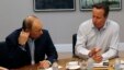 Russia's President Vladimir Putin (L) talks with Britain's PM David Cameron during a working session at the Lough Erne golf resort where the G8 summit is taking place in Enniskillen, Northern Ireland, June 18, 2013. 