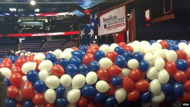 Red, white and blue balloons bundled up before being lifted to the ceiling of the Tampa Bay Times Forum for the traditional "balloon drop" on the final convention night.
