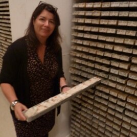 Core Repository Director Maureen Raymo pulls out a sea sediment sample, one of thousands at the archive.