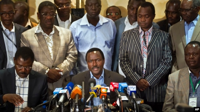 Kalonzo Musyoka, center, Kenya's current Vice President and running mate of presidential candidate Raila Odinga, speaks at a press conference in Nairobi, Kenya, Mar. 7, 2013.