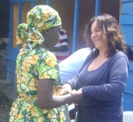 Picture here in Goma, FXBVillage founder Albina du Boisrouvray meets with a woman benefiting from the aid program. (AP PHOTO)
