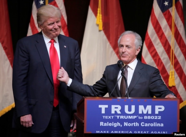 FILE - Republican U.S. presidential candidate Donald Trump listens as Sen. Bob Corker speaks at a campaign rally in Raleigh, North Carolina, July 5, 2016.
