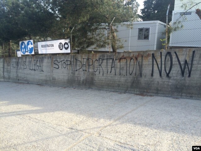 Graffiti outside the refugee camp, now essentially a detention center, in Lesbos, Greece, April 1, 2016. (H. Murdock/VOA)