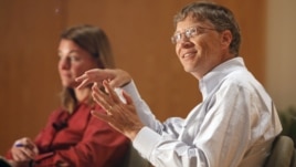 Bill Gates, accompanied by his wife Melinda speak to students at an appearance at Central Piedmont Community College in Charlotte, North Carolina. 