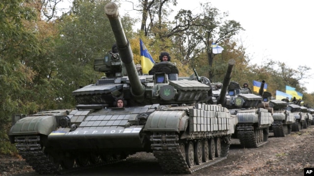 Ukrainian tanks move near Mariupol, Donetsk region, eastern Ukraine, Oct. 21, 2015.