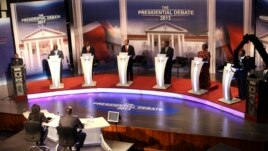 The eight Kenyan presidential aspirants Mohammed Dida, James Ole Kiyiapi, Uhuru Kenyatta, Peter Kenneth, Musalia Mudavadi, Martha Karua, Kenyan Prime Minister Raila Odinga and Paul Muite (L-R) face off in a presidential debate in Nairobi, February 11, 201