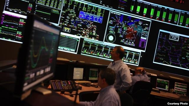 PJM manages the flow of electricity to 60 million customers in 13 US states from its control room in Valley Forge, Pennsylvania.  (Courtesy PJM Interconnection)