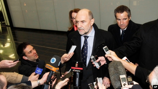 Herman Nackaerts (C), Deputy Director General and Head of the Department of Safeguards of the International Atomic Energy Agency, talks to media after his arrival from Iran at Vienna's Schwechat airport, Austria, February 14, 2013.