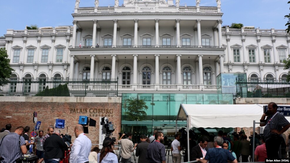 Journalists gather in front of the Palais Coburg, the venue for Iran nuclear talks in Vienna, Austria, July 2, 2015. 