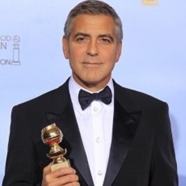 George Clooney poses with his award for best actor in a motion picture - drama for "The Descendants," backstage at the 69th annual Golden Globe Awards in Beverly Hills, California, January 15, 2012.