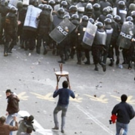Egyptian demonstrators clash with police in central Cairo during a protest demanding the ouster of President Hosni Mubarak and calling for reforms, Jan 25 2011.