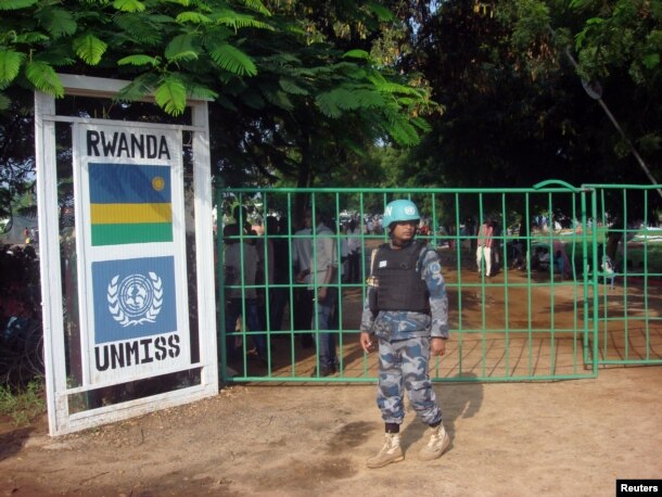 FILE - A U.N. peacekeeper stands outside a camp for internally displaced people in the United Nations Mission in South Sudan (UNMISS) compound in Tomping, Juba, South Sudan, July 11, 2016.